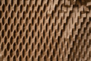 Close-up of a textured honeycomb pattern paper, showcasing geometric design and craft elements.
